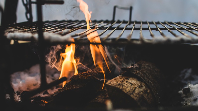 fire under a grill grate